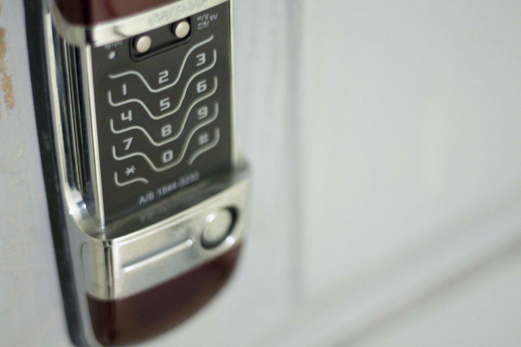 Locksmith repairing door lock mechanism South London