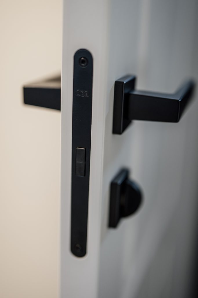 Close-up of a modern door handle and lock — British Standard security