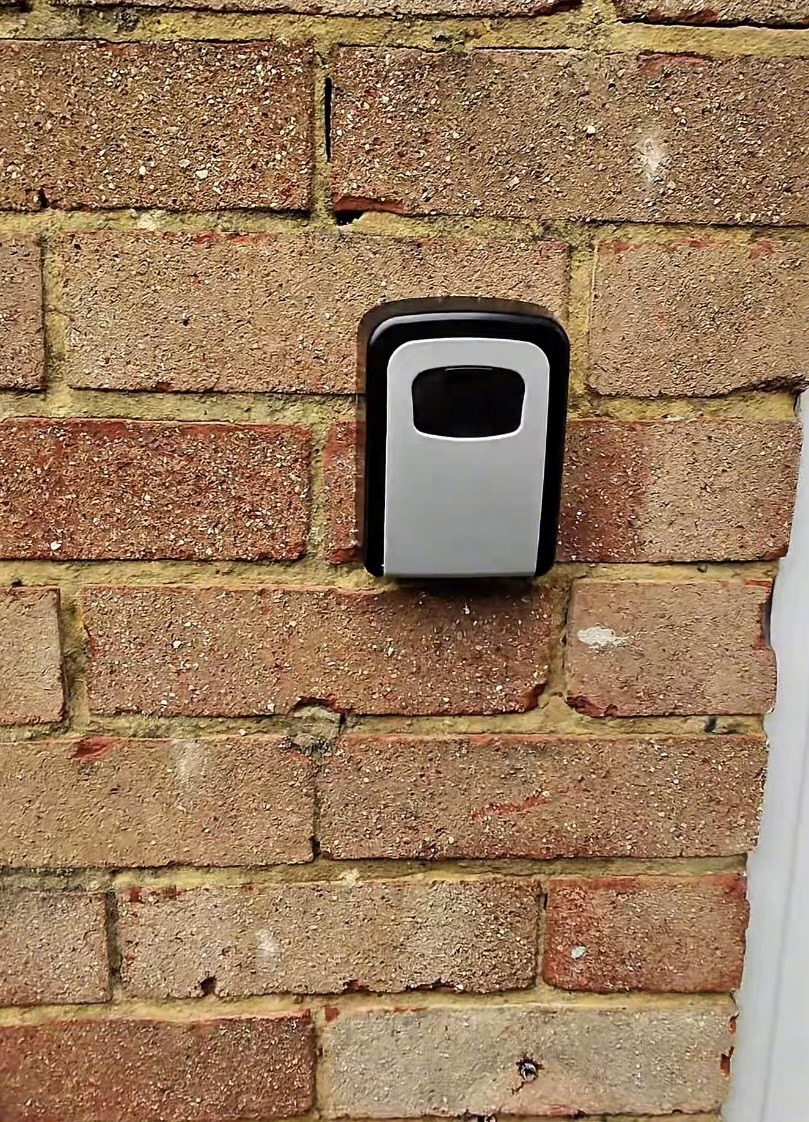 Finished key safe fitted to brick wall at front of a South London home