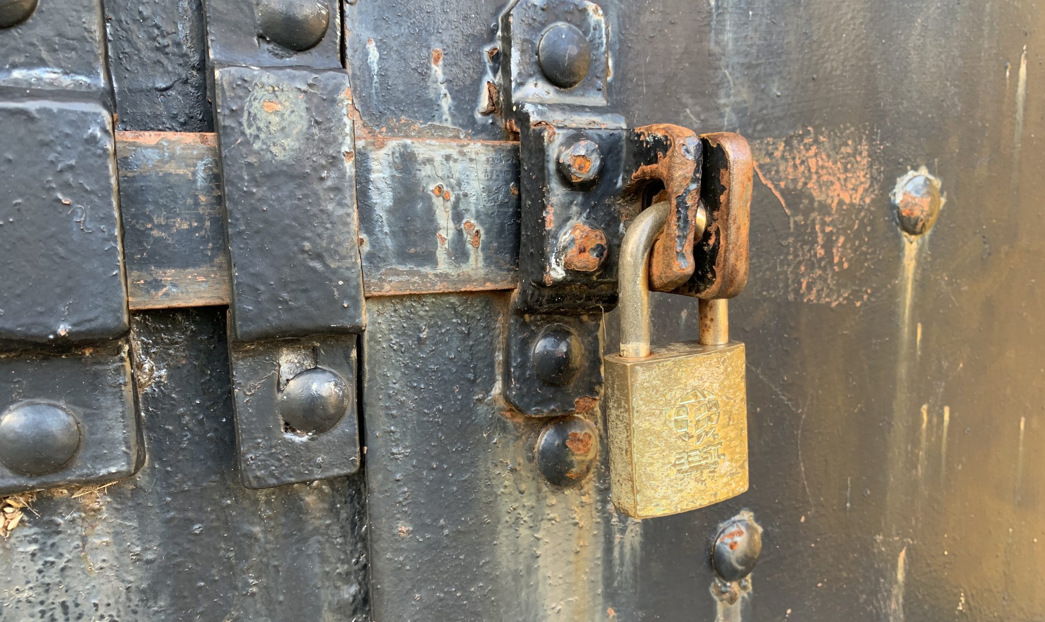 Professional locksmith fitting a secure door lock in Banstead SM7