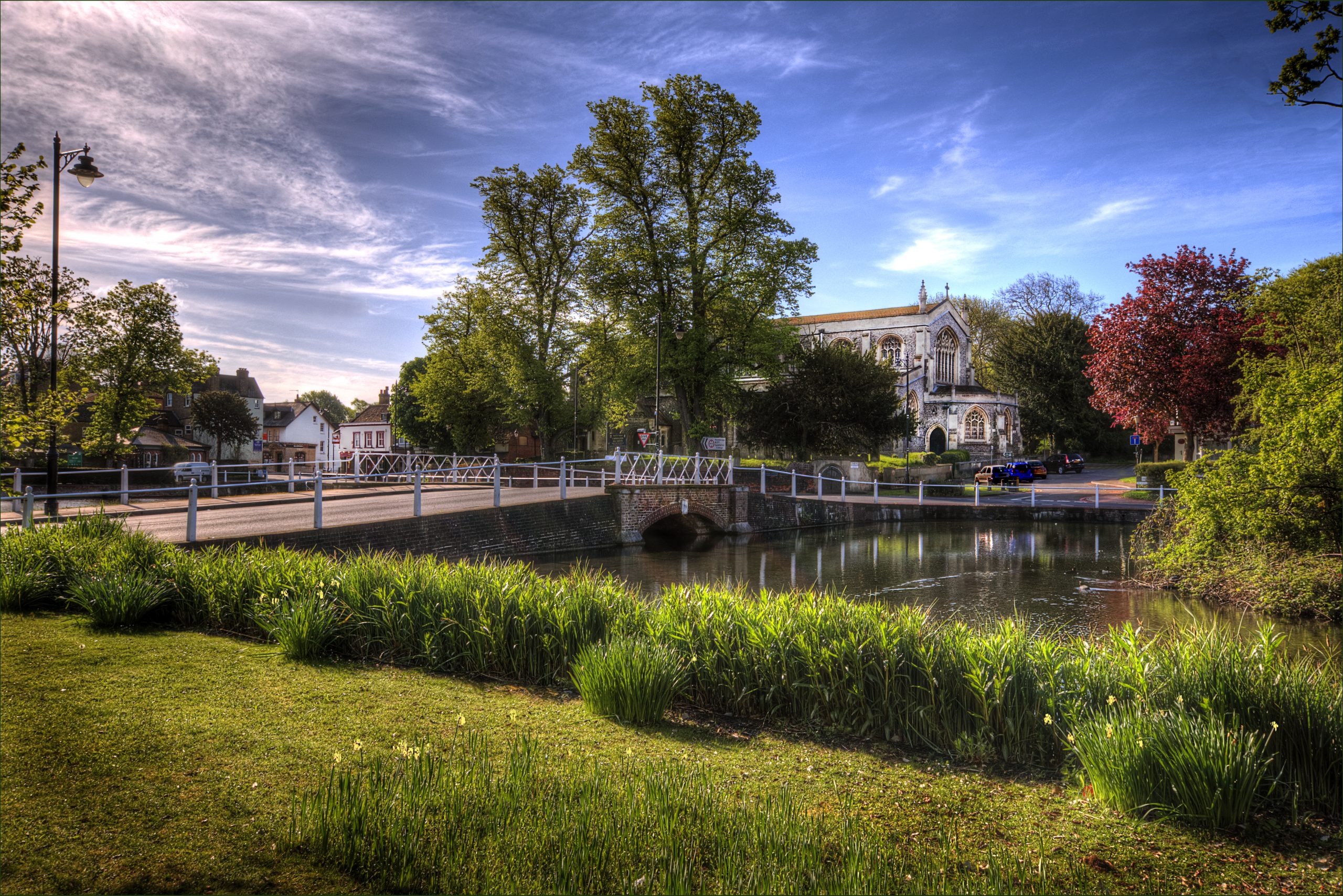 Carshalton Ponds with the white footbridge and All Saints Church, Carshalton SM5