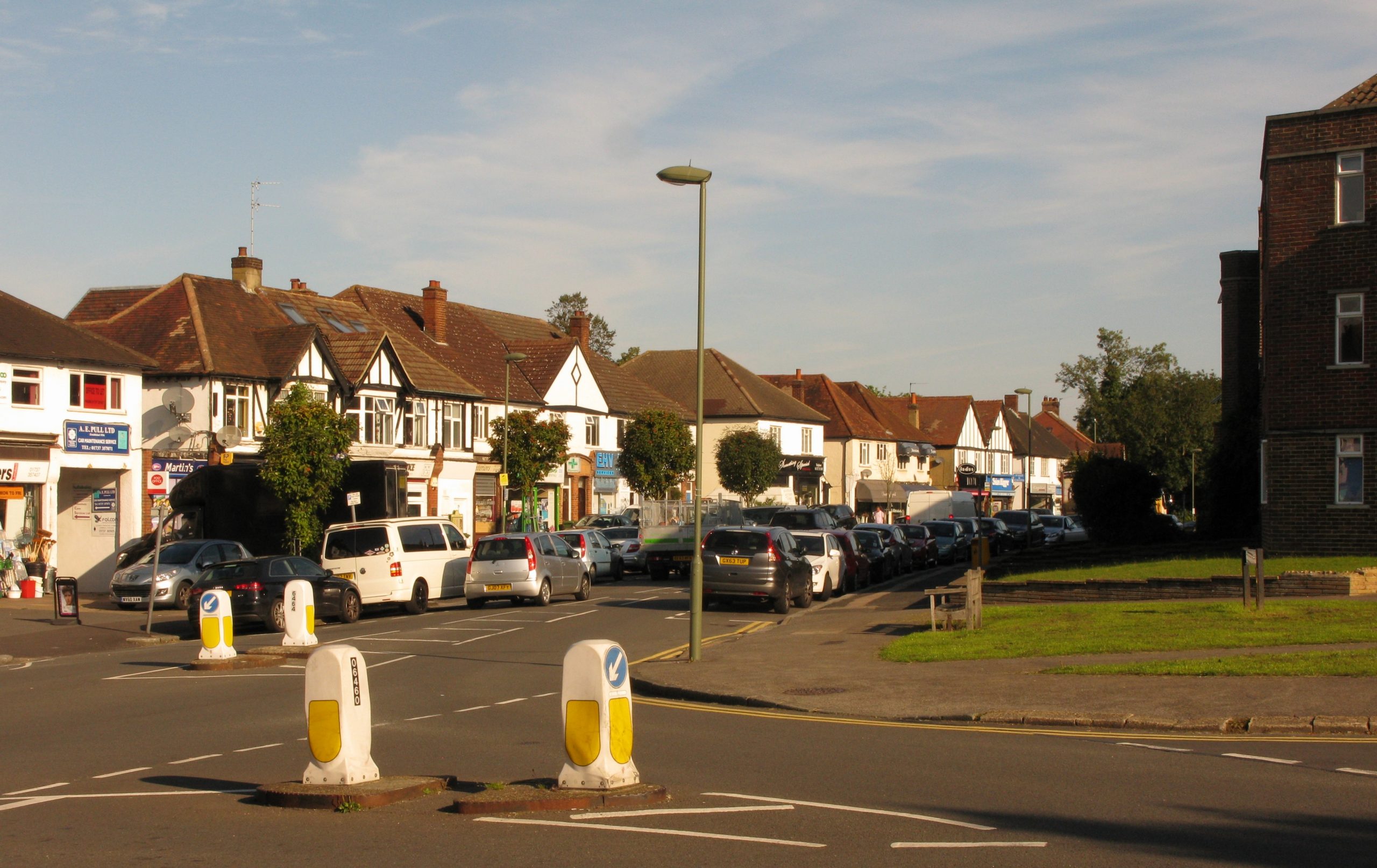 Parade of shops and period homes on Nork Way, Banstead SM7