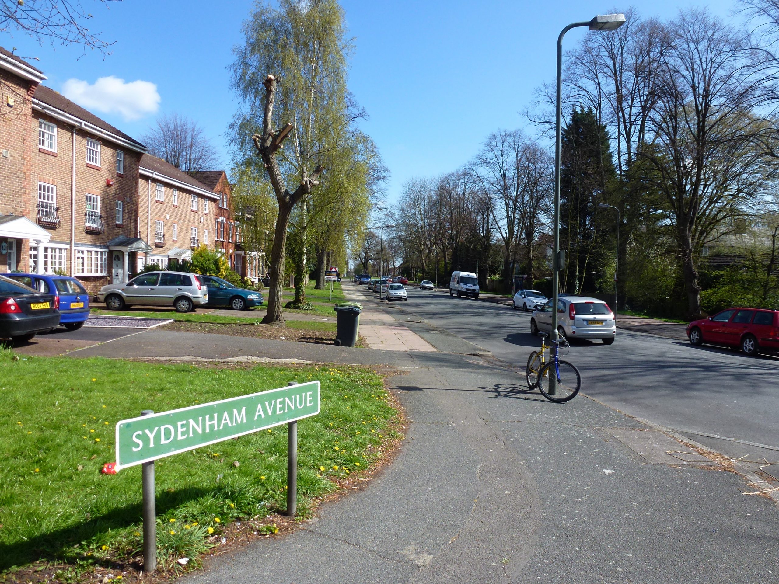 Sydenham Avenue SE26 street sign with period brick homes and parked cars, Sydenham SE26